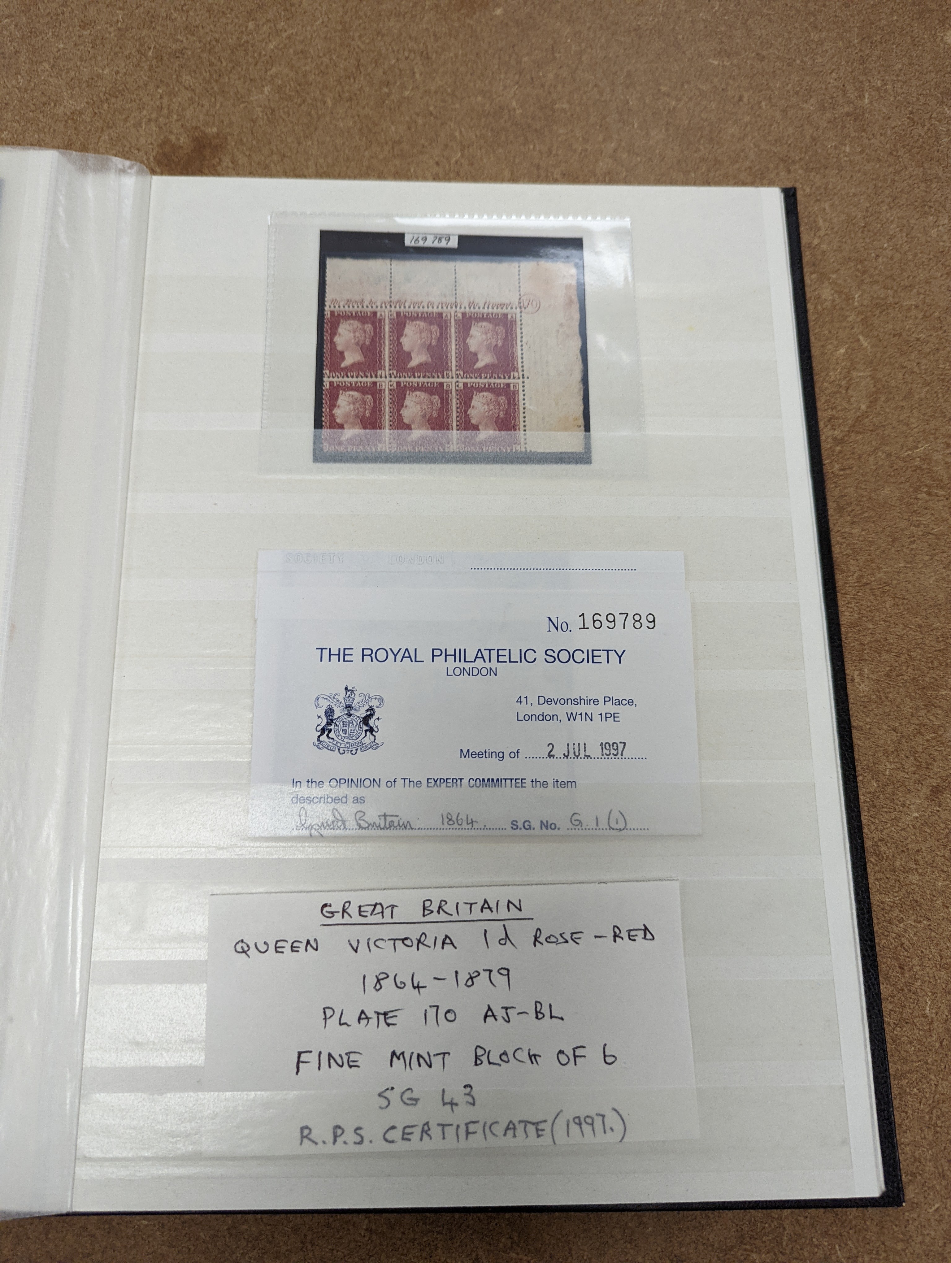 Great Britain stamps in stock book with 1840 1d black and 1841 2d blue unused. 1841 1d red brown mint block of 8, 1864-79 1d red plates in mint blocks including plate 79 block of 48, plate 170 block of 6 with marginal in